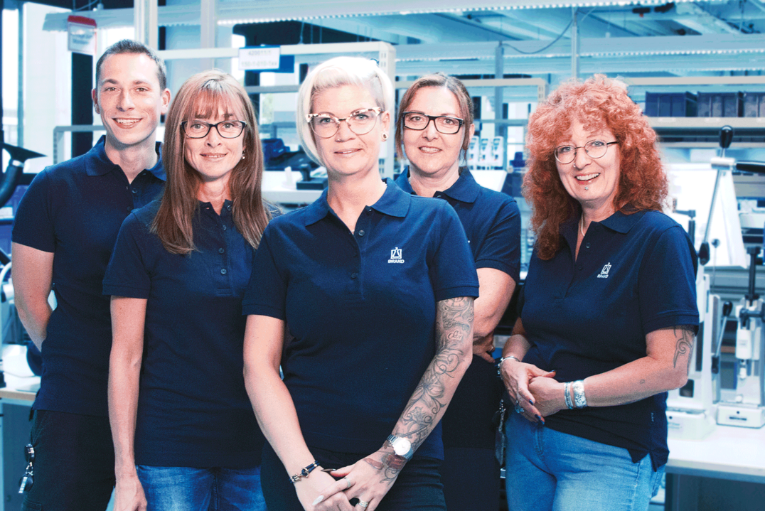 Employees looking into the camera